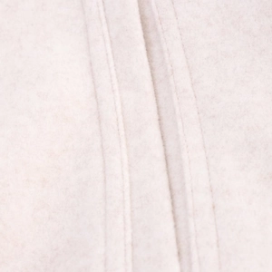 Close-up of white wool blend fabric with detailed parallel double stitching on jacket