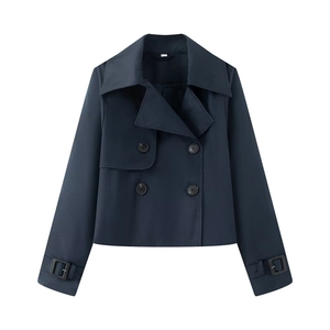 Detail of short navy blue double-breasted trench coat with wide lapels and cuff straps