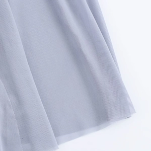 Detailed view of light purple double-layer mesh fabric with sheer texture and drapes