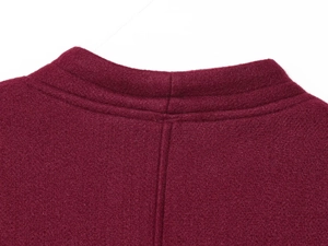 Detail of wine red wool coat showing round neckline and high-quality back stitching