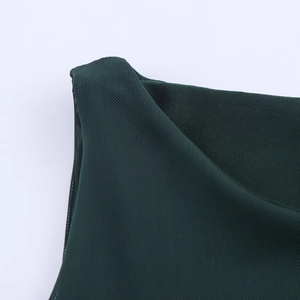 Close-up of the forest green mesh knit fabric detail on a sleeveless long dress