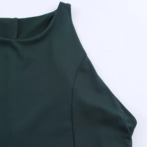 Detail of dark green mesh maxi dress showing the sleeveless neckline and sewing craftsmanship