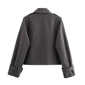 Back view of dark grey cropped trench coat with epaulettes and adjustable cuffs