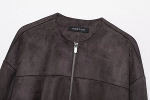 Detail view of the vintage faux suede jacket collar with zipper and textured fabric