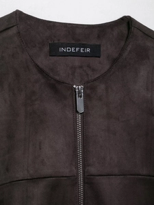 Detail of dark brown faux suede jacket collar with silver metal zipper and brand label
