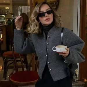 Women's minimalist grey tweed jacket with silver buttons and round neck design
