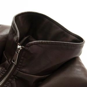 Detail of faux leather jacket featuring double layer collar and silver metal zipper