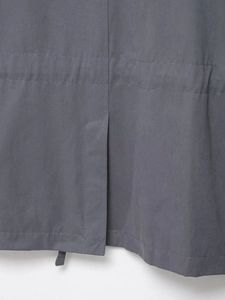 Detail view of charcoal gray cargo jacket back vent and reinforced parallel stitching