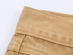 Macro shot of khaki twill cotton waistband with dense stitching and durable texture