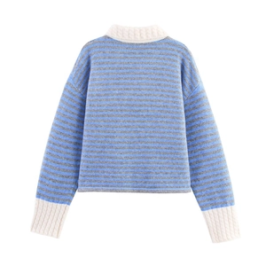 Detail of blue and grey striped knit cardigan with contrast cream ribbed collar and cuffs