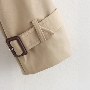 Classic khaki cropped trench coat sleeve detail with high-density twill and buckle