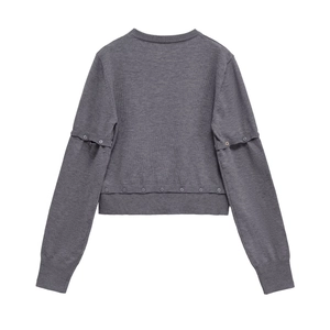 Dark grey knit sweater with button sleeve details and ribbed cuffs on white background