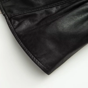 Close-up of black faux leather jacket texture with high-quality double stitching detail