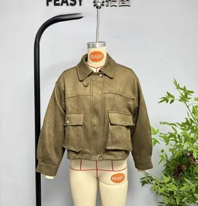 Detail of dark green faux suede bomber jacket featuring large pockets and lapel collar