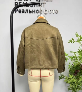 Back view of a dark green faux suede aviator jacket with seam details and a collared neckline