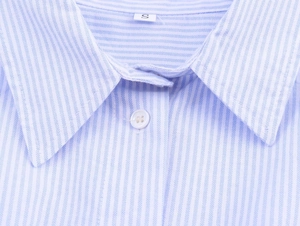 Detail of the blue and white striped shirt collar with standard lapel and size S tag