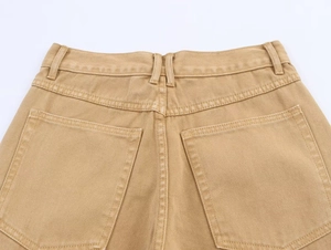 Detailed macro view of khaki casual pants showing back waist pockets and twill fabric texture