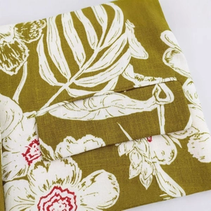 Olive green floral print linen blazer featuring classic flap pocket and vintage texture