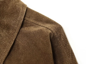 Detailed close-up showing texture of dark brown suede bomber jacket collar and stitching