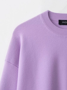 Detail of lavender ribbed knit sweater showing neckline and premium fabric texture