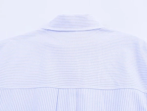Detailed view of the back yoke and collar on a blue and white striped cotton shirt
