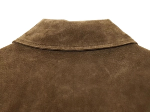 Detailed close-up of dark brown suede bomber jacket collar showing premium stitching