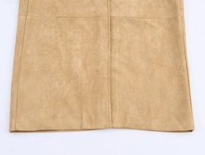 Detail of tan faux suede coat fabric with high-quality double-stitching and texture