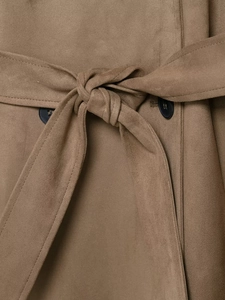 Macro detail of brown faux suede trench coat featuring waist belt and black buttons