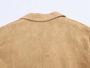 Detail view of khaki faux suede coat showing the collar and vertical back stitching texture