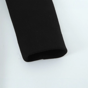 Detailed view of the cuff on a slim-fit black belted coat made of premium wool blend fabric