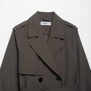 Classic double-breasted trench coat in charcoal grey with wide lapels and shoulder tabs