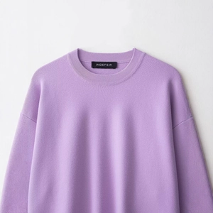 Minimalist lavender rib-knit sweater with a round neck and soft textured fabric detail