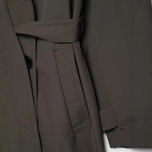 Women's dark grey hydrophobic windbreaker with adjustable waist belt and double pockets