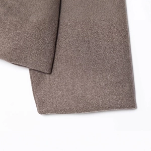 Short minimalist brown wool blend jacket with classic collar and fine texture