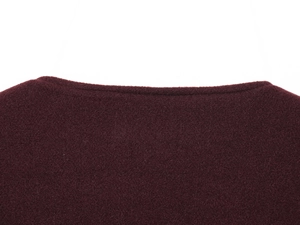 Close-up of burgundy wool-texture bomber jacket neckline with golden button detail