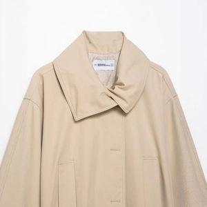Classic khaki mid-length trench coat with wide notched lapels and side pockets