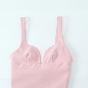 Pink sleeveless V-neck crop top with wide shoulder straps and side zipper closure