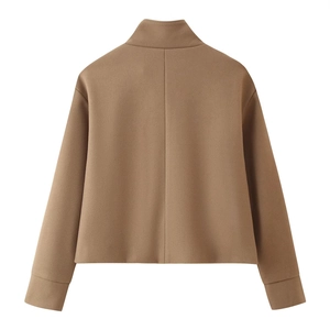 Detail view of the stand-up collar and back seam on this camel cropped wool jacket