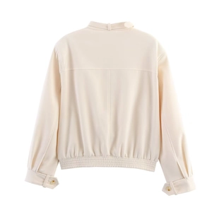 Back view of solid beige casual jacket with elasticated hem and buckled stand collar