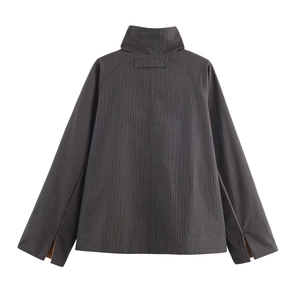 Detail view of the high stand collar and back tailoring of the dark grey striped jacket