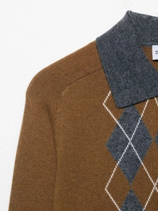 Close-up of argyle pattern and contrasting collar on brown knit polo sweater