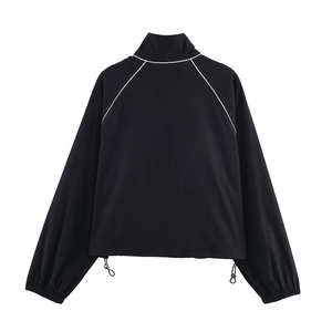 Minimalist black nylon puffer jacket featuring white piping and adjustable drawstring hem