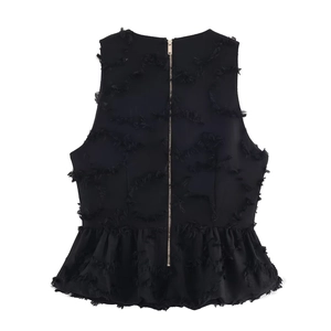 Elegant black sleeveless peplum top with textured fringe details and golden back zipper
