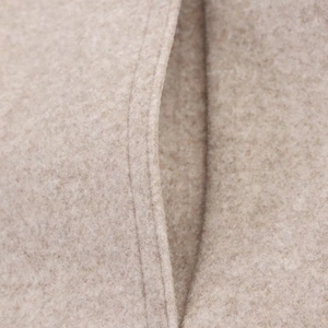 Detail showing high-quality stitching and texture of soft beige wool blend jacket
