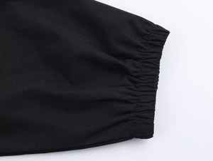 Close-up of black nylon jacket sleeve with high-quality elastic ribbed cuff details