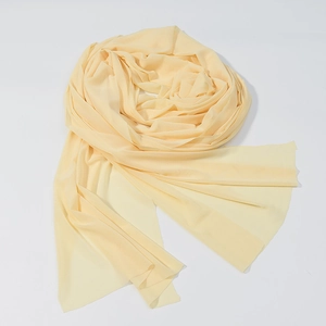 Détail du tissu en maille beige clair montrant la texture douce et les bords francs