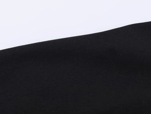 Detailed macro view of high-quality black nylon fabric texture and fine weaving on the jacket