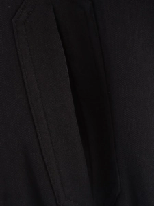 Macro shot of high-density black twill fabric with reinforced double-stitch detailing