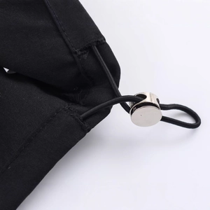 Minimalist nylon puffer jacket with adjustable elastic drawstring and silver cord lock