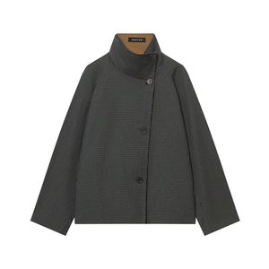 Detail of dark grey plaid jacket with standing collar and brown inner fabric contrast